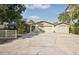 House exterior with driveway and landscaping at 6462 Beechwood Ave, Sarasota, FL 34231