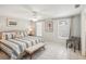 Spacious bedroom with king-size bed, tiled floors, and ample natural light at 6462 Beechwood Ave, Sarasota, FL 34231