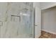 Clean and modern shower with marble tile and glass door at 2023 Mesic Hammock Way, Venice, FL 34292