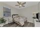 Cozy bedroom with full bed, ceiling fan, and ample closet space at 2023 Mesic Hammock Way, Venice, FL 34292