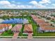 Aerial view of house, landscaping, and neighborhood at 2023 Mesic Hammock Way, Venice, FL 34292