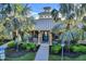 Welcoming community clubhouse with teal doors and lush landscaping at 4808 Charles Partin Dr, Parrish, FL 34219