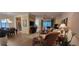 Bright and airy living room with hardwood floors and wicker furniture at 4808 Charles Partin Dr, Parrish, FL 34219