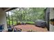 Relaxing screened porch with brick pavers and outdoor grill at 4808 Charles Partin Dr, Parrish, FL 34219