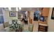 Open dining room with glass table and bamboo chairs, near kitchen at 4808 Charles Partin Dr, Parrish, FL 34219