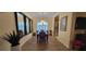 Elegant dining room with hardwood floors, chandelier, and large mirrors at 4808 Charles Partin Dr, Parrish, FL 34219
