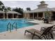 Community pool with lounge chairs and tables at 4808 Charles Partin Dr, Parrish, FL 34219