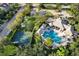 Aerial view of community pool, basketball court, and clubhouse at 4808 Charles Partin Dr, Parrish, FL 34219
