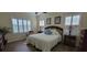 Comfortable bedroom with a queen-size bed and plenty of natural light at 4808 Charles Partin Dr, Parrish, FL 34219