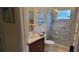 Well-appointed bathroom with single vanity, shower, and tiled floor at 4808 Charles Partin Dr, Parrish, FL 34219
