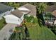 Aerial view of a charming single-Gathering house with a well-manicured lawn at 4808 Charles Partin Dr, Parrish, FL 34219