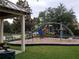 Modern playground structure with climbing features and shaded area at 4808 Charles Partin Dr, Parrish, FL 34219