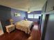 Spacious Primary bedroom with hardwood floors and large bed at 5317 Chateau Ln, Bradenton, FL 34207