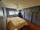 Main bedroom with king-size bed and ceiling fan at 5317 Chateau Ln, Bradenton, FL 34207