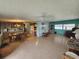 Open living room and dining area with wood-look floors at 5317 Chateau Ln, Bradenton, FL 34207