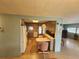 Kitchen with breakfast bar and view into living area at 5317 Chateau Ln, Bradenton, FL 34207