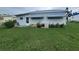 Rear view of single-wide manufactured home at 5317 Chateau Ln, Bradenton, FL 34207