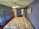 Main bedroom with king bed and ceiling fan at 5317 Chateau Ln, Bradenton, FL 34207