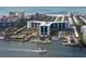 Scenic waterfront property with a marina, tennis courts, and lush landscaping, perfect for recreation and relaxation at 5855 Midnight Pass Rd # 319, Sarasota, FL 34242