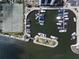 Scenic marina with well-maintained docks, lush landscaping, and easy access to the open water for boating enthusiasts at 5855 Midnight Pass Rd # 319, Sarasota, FL 34242