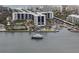 Beautiful waterfront property with marina, tennis courts, and lush greenery offering a serene and active lifestyle at 5855 Midnight Pass Rd # 319, Sarasota, FL 34242