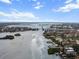 Panoramic aerial view of a coastal waterway and residential community, showcasing the scenic landscape and bridge at 5855 Midnight Pass Rd # 319, Sarasota, FL 34242