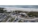 An aerial view features a beachside park and recreation area with abundant parking and many people enjoying the surf and sand at 5855 Midnight Pass Rd # 319, Sarasota, FL 34242