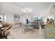 Bright dining area featuring a glass table, seating for four, neutral colors, tile flooring and lots of natural light at 5855 Midnight Pass Rd # 319, Sarasota, FL 34242