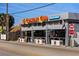 Charming roadside bar and package store, Crescent Club, featuring a covered patio and drive-up liquor window at 5855 Midnight Pass Rd # 319, Sarasota, FL 34242