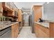 Updated kitchen boasts stainless steel appliances, granite countertops, and ample cabinet space at 5855 Midnight Pass Rd # 319, Sarasota, FL 34242