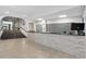 Reception area featuring a stone counter, stairs, and tiled floors at 5855 Midnight Pass Rd # 319, Sarasota, FL 34242