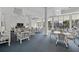 Brightly lit lounge area with comfortable furniture and scenic views for relaxing with friends and Gathering at 5855 Midnight Pass Rd # 319, Sarasota, FL 34242