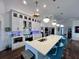 Modern kitchen with white cabinets, quartz countertops, and stainless steel appliances at 1362 Hedgewood Cir, North Port, FL 34288