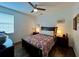 Bright bedroom with a comfortable bed and wood floors at 1362 Hedgewood Cir, North Port, FL 34288