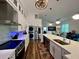 Modern kitchen with white cabinets, quartz countertops and stainless steel appliances at 1362 Hedgewood Cir, North Port, FL 34288