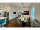 Bright dining area with a light wood table and teal chairs at 1362 Hedgewood Cir, North Port, FL 34288