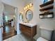 Modern bathroom with floating vanity and walk-in shower at 1362 Hedgewood Cir, North Port, FL 34288