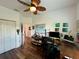 Home office with large desk, ample storage and hardwood floors at 1362 Hedgewood Cir, North Port, FL 34288