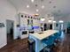 Modern kitchen with white cabinets, quartz counters, and stainless steel appliances at 1362 Hedgewood Cir, North Port, FL 34288