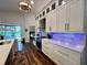 Modern kitchen with white cabinets, stainless steel appliances, and quartz countertops at 1362 Hedgewood Cir, North Port, FL 34288