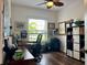 Home office with built-in shelving and hardwood floors at 1362 Hedgewood Cir, North Port, FL 34288