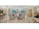 Spacious living room with marble floors, large windows and city views at 990 Blvd Of The Arts # 404, Sarasota, FL 34236