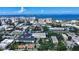 Aerial view of a house and surrounding neighborhood, showcasing the property's location and proximity to other buildings at 1569 7Th St, Sarasota, FL 34236