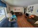 Living room with hardwood floors and access to patio at 5530 Denmark Dr, Bradenton, FL 34207