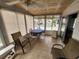 Sunroom with table and chairs, offering a tranquil outdoor view at 5530 Denmark Dr, Bradenton, FL 34207