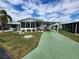 Mobile home with carport and landscaped yard at 5530 Denmark Dr, Bradenton, FL 34207