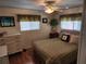 Bedroom with wood floors, double bed, and dresser at 5530 Denmark Dr, Bradenton, FL 34207
