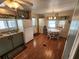 Bright kitchen with wood floors, white appliances, and light green cabinets at 5530 Denmark Dr, Bradenton, FL 34207