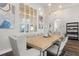 Elegant dining room featuring a statement chandelier and a light and airy feel at 729 Tailwind Pl, Sarasota, FL 34240