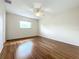 Light-filled bedroom with wood-look floors and a ceiling fan at 3276 Westford Ln, #117,, Sarasota, FL 34231